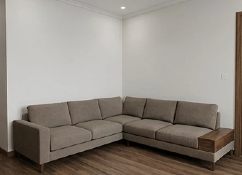 Bộ sofa hình chữ L được kê vuông góc ôm sát hai bức tường tạo ra không gian tiếp khách ấm cúng và an toàn