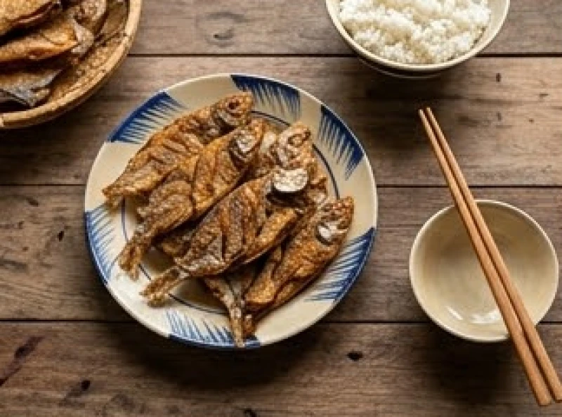Mơ thấy cá khô: Giải mã điềm báo cát hung & con số may mắn 5 Mâm cơm gia đình truyền thống với đĩa cá khô chiên giòn và bát cơm trắng