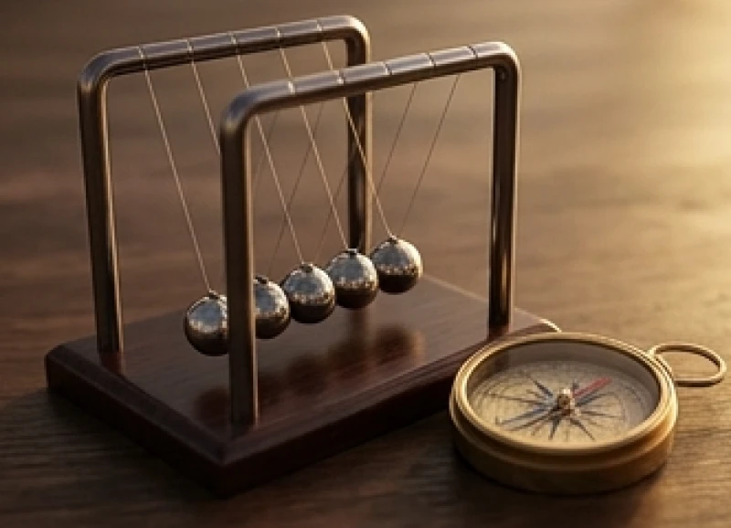 Con lắc Newton và la bàn cổ điển đại diện cho tính quy luật và công cụ đo lường sự kiện
