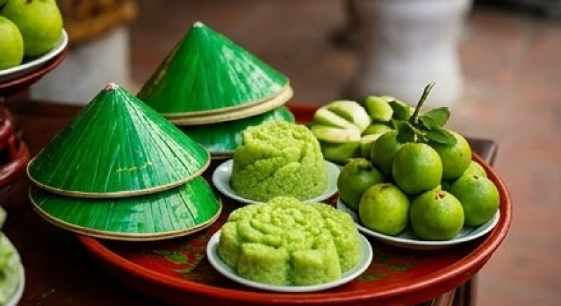 Mâm đồ mã dâng ban Sơn Trang với bộ nón hài và oản tài lộc mang màu xanh lá cây đặc trưng