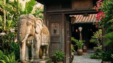 Tượng voi đá phong thủy uy nghi đặt trước ngôi nhà truyền thống Việt Nam gợi nhắc điềm báo mơ thấy tượng voi đá cát tường