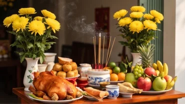 Mâm lễ vật tươm tất với heo quay và hoa cúc vàng được chuẩn bị kỹ lưỡng khi xem tuổi hợi khai trương ngày nào tốt