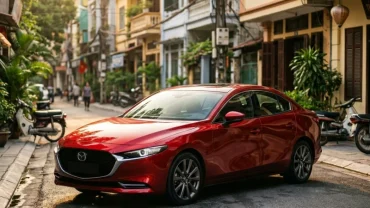 Mẫu xe ô tô màu đỏ sang trọng đỗ trước ngôi nhà hiện đại tại Việt Nam cho người thắc mắc tuổi mão hợp xe màu gì